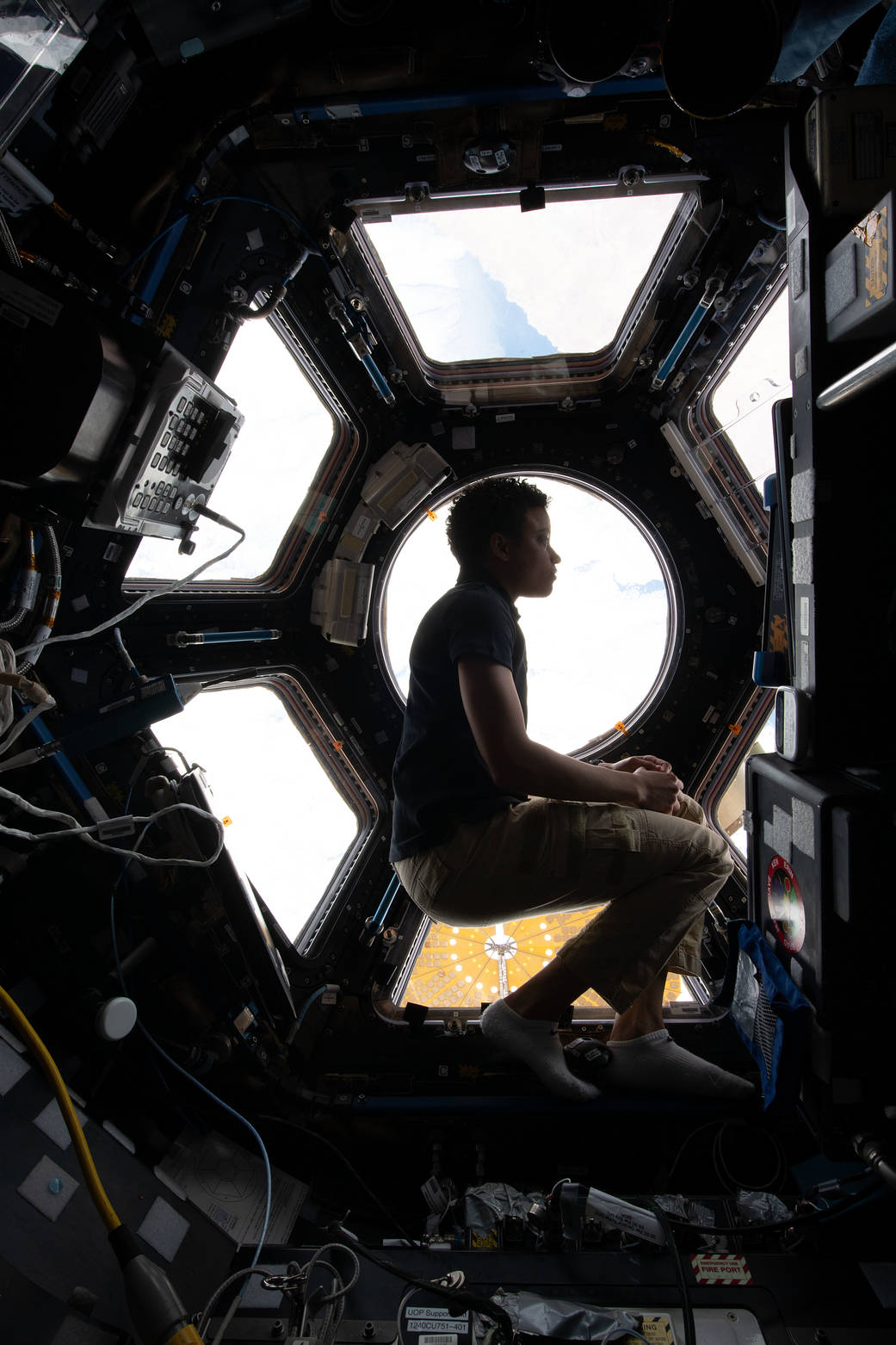 NASA astronaut Jessica Watkins looking through the International Space Station cupola